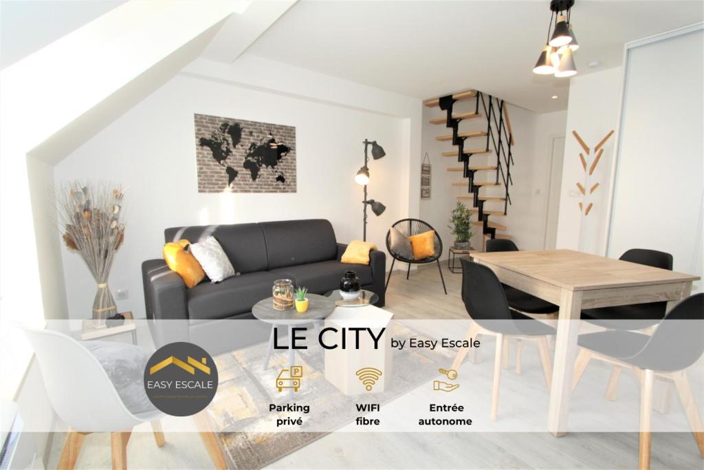 a living room with a couch and a table at Le City by EasyEscale in Romilly-sur-Seine