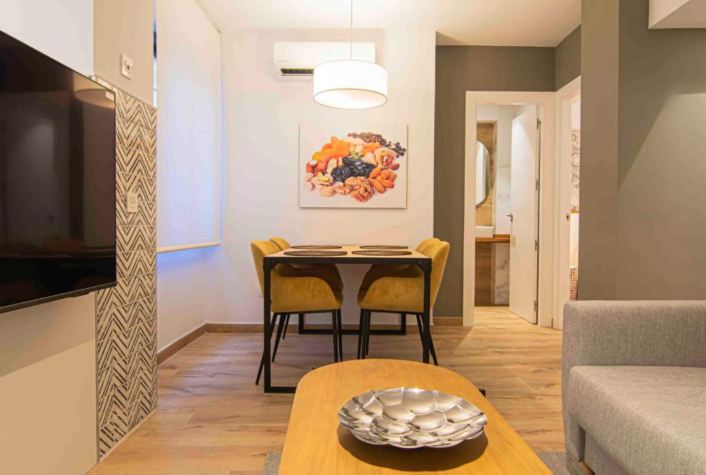 Telewizja i/lub zestaw kina domowego w obiekcie Apartamentos Leonor