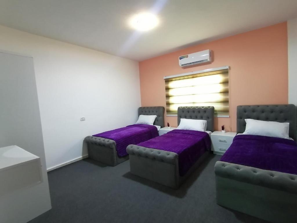 Postel nebo postele na pokoji v ubytování Petra paradise home