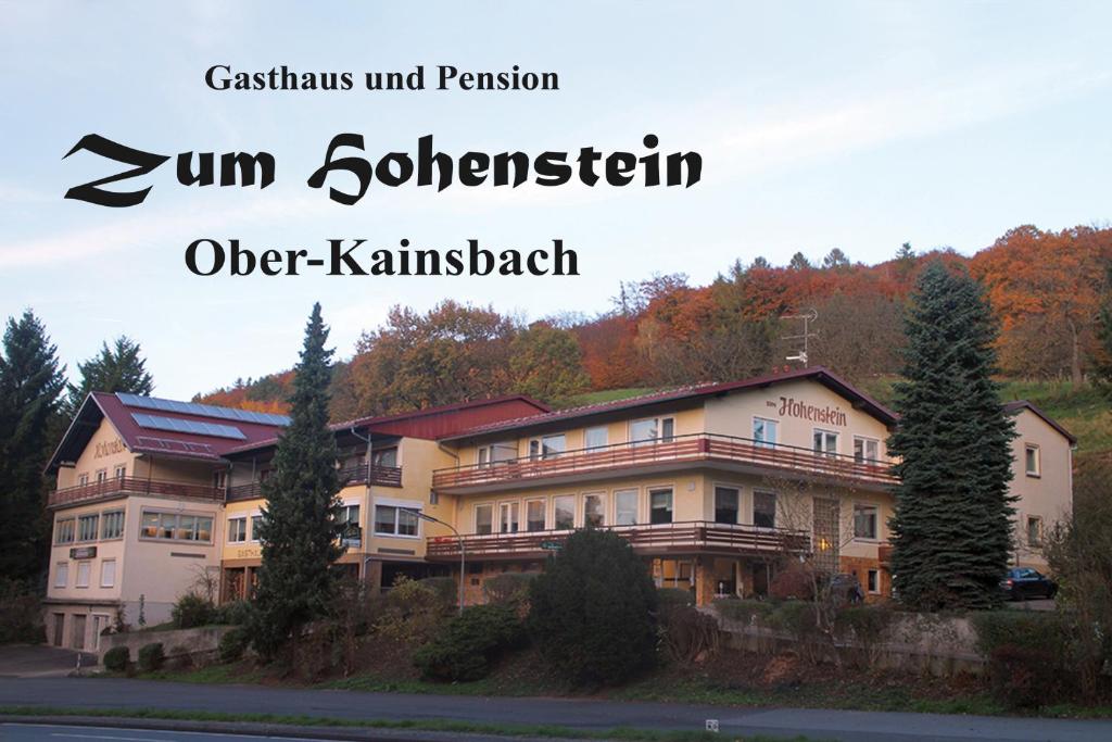 a building on the side of a road with the words sun bohemianvelt at Gasthaus Zum Hohenstein in Ober-Kainsbach