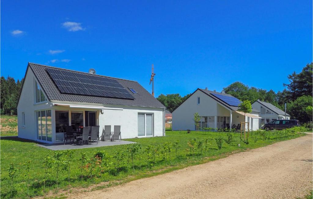 a house with solar panels on the roof at Ferienhaus 4 Wolfschlucht in Prüm
