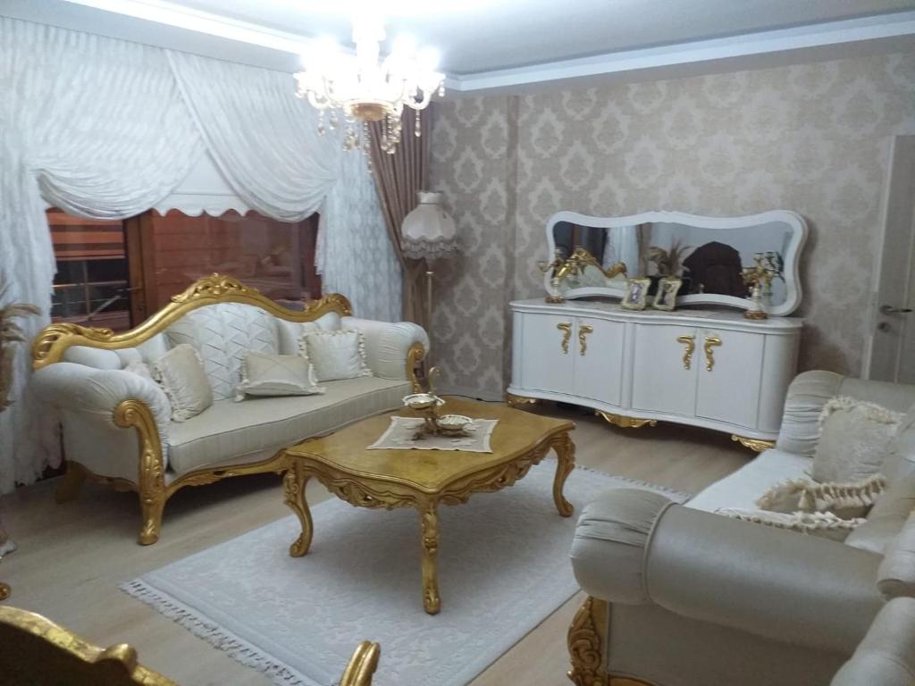 a living room with a couch and a table at Trabzon Luxury Homes in Trabzon