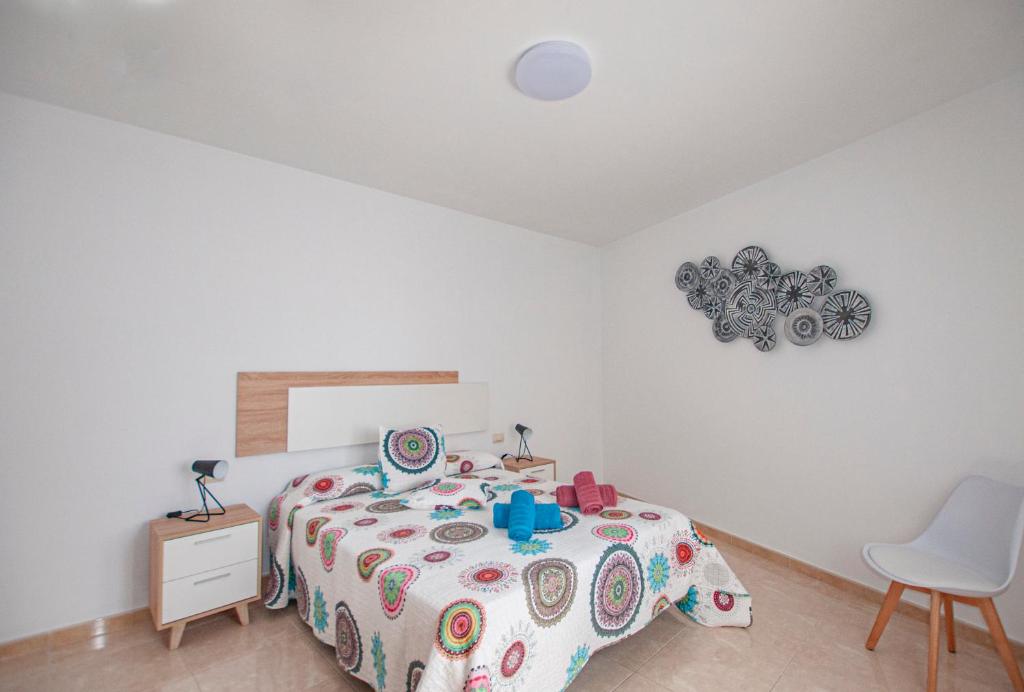 Posteľ alebo postele v izbe v ubytovaní Apartamento Cruz de Toledo