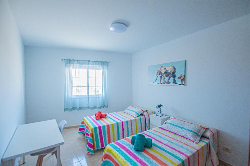 Posteľ alebo postele v izbe v ubytovaní Apartamento Cruz de Toledo