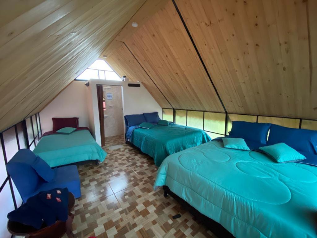 Postel nebo postele na pokoji v ubytování Hospedaje Villa Rosita Suesca