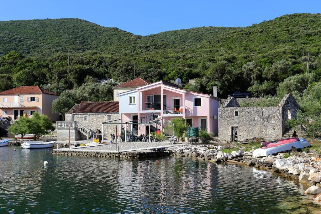 a house by the water with a dock at Apartments by the sea Zuronja, Peljesac - 10123 in Brijesta