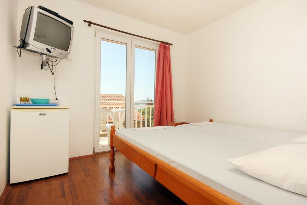 Postel nebo postele na pokoji v ubytování Apartments and rooms with parking space Orebic, Peljesac - 10192