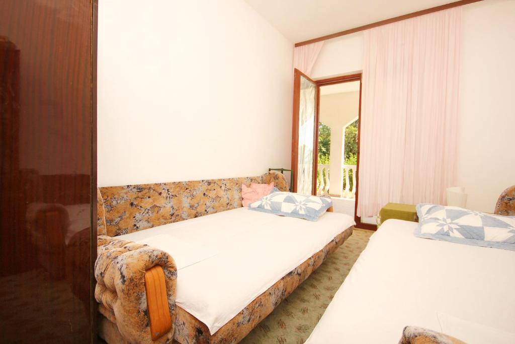 Posteľ alebo postele v izbe v ubytovaní Apartments with parking spaces Orebic, Peljesac - 10193