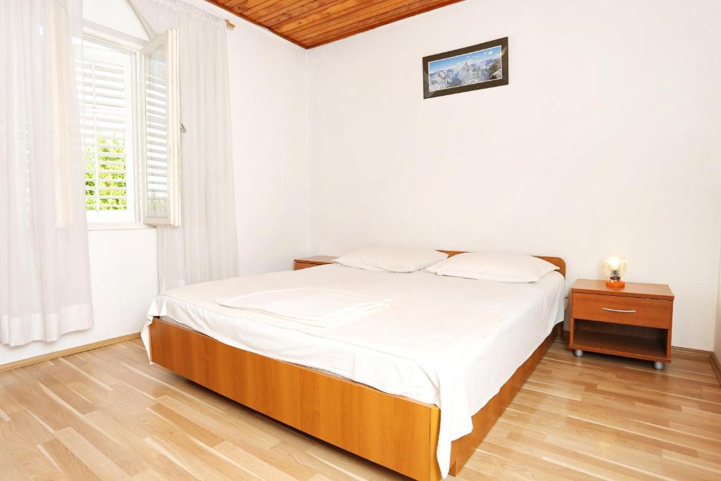 Postel nebo postele na pokoji v ubytování Apartments with parking spaces Orebic, Peljesac - 10102