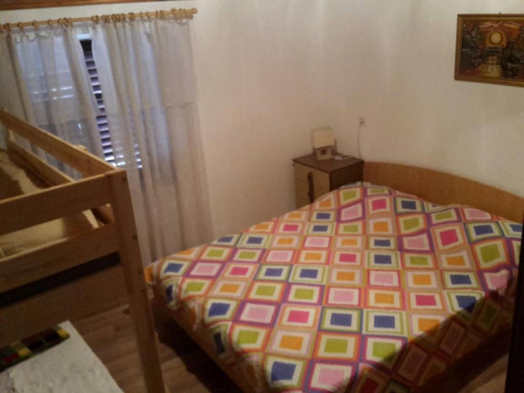 Postel nebo postele na pokoji v ubytování Apartment Viganj 10140b