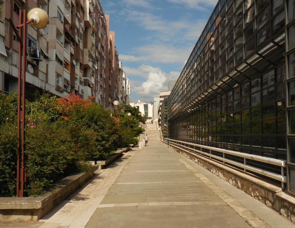 an empty street in a city with tall buildings at Apartments with WiFi Split - 11692 in Split