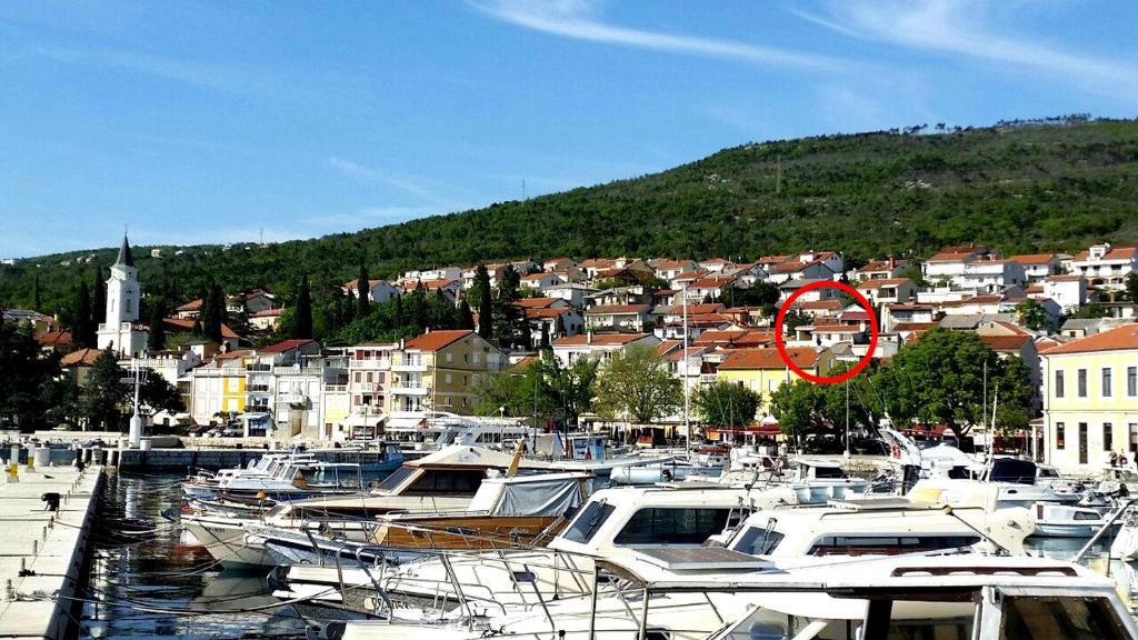 a bunch of boats are docked in a harbor at Apartments by the sea Selce, Crikvenica - 11693 in Selce
