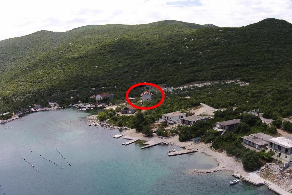 an aerial view of a resort with a red circle at Apartments by the sea Kabli, Peljesac - 11695 in Brijesta