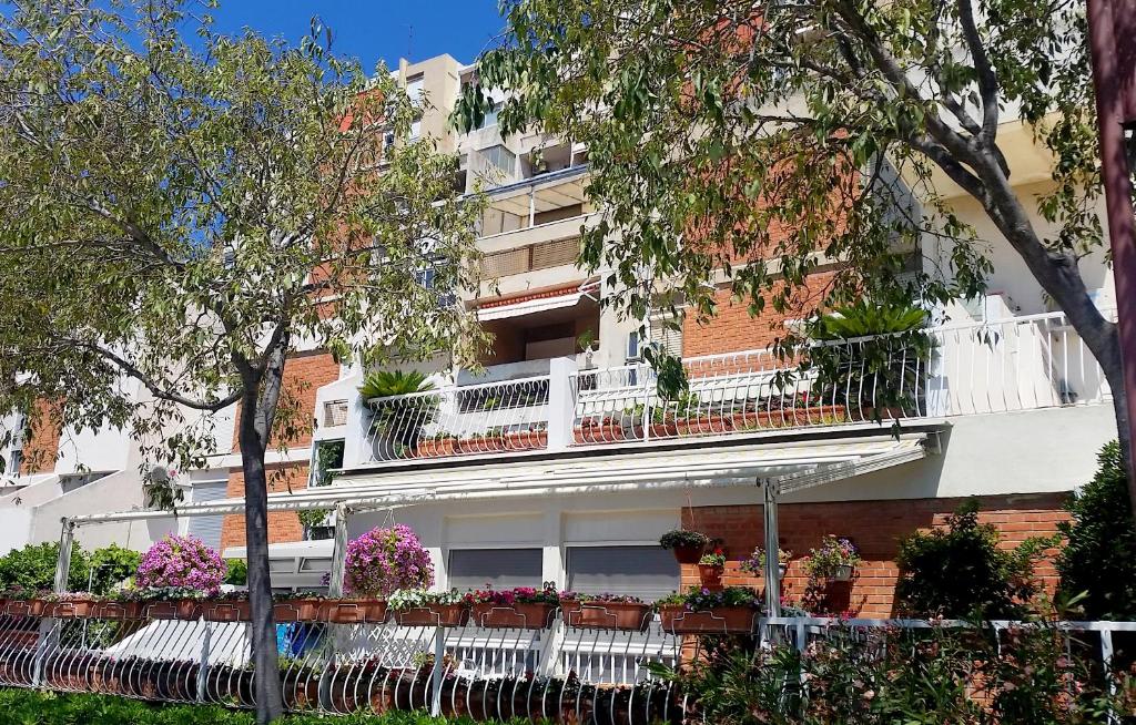 an apartment building with flowers on the balconies at Apartments with WiFi Split - 11783 in Split