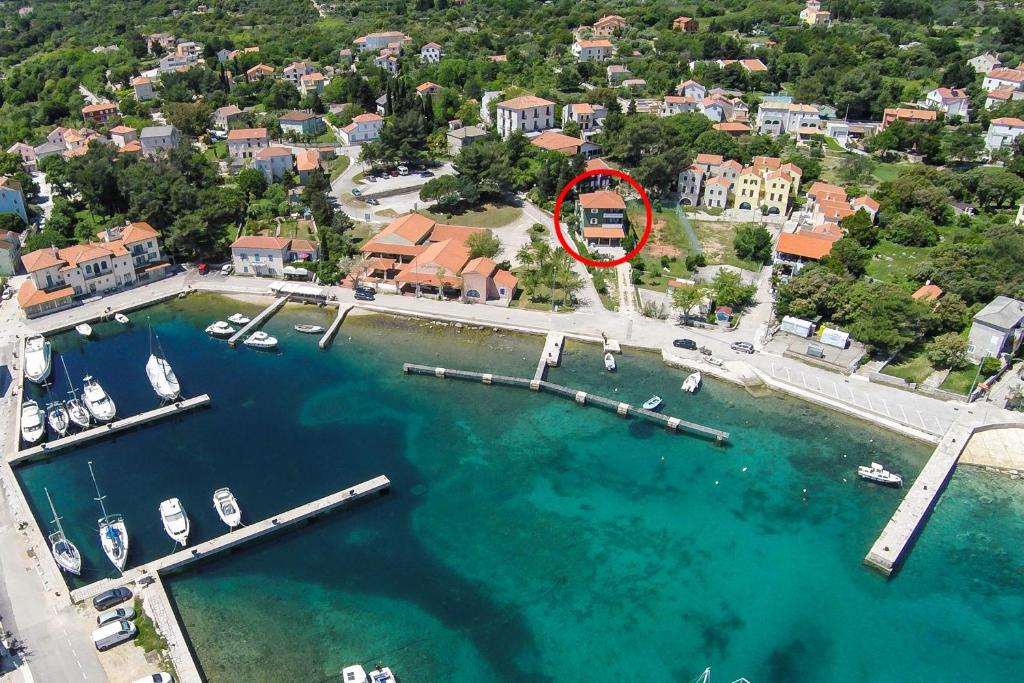 an aerial view of a marina with boats in the water at Apartments and rooms by the sea Nerezine, Losinj - 11815 in Nerezine