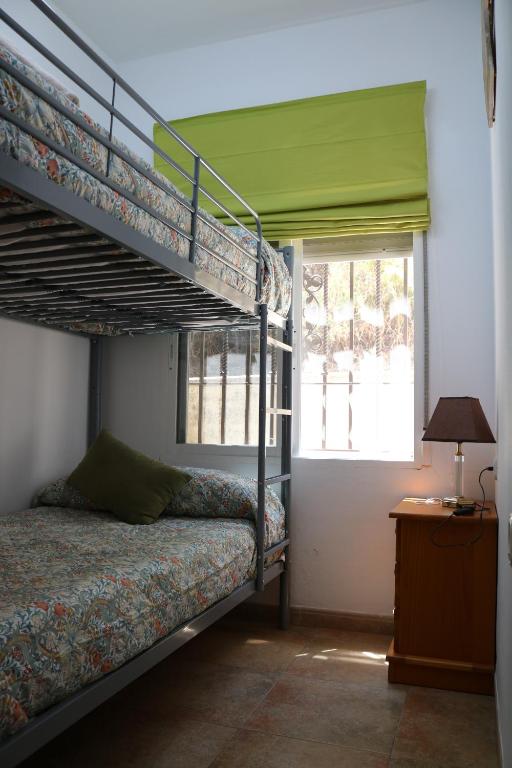 A bed or beds in a room at EL RINCON DE ANGELA