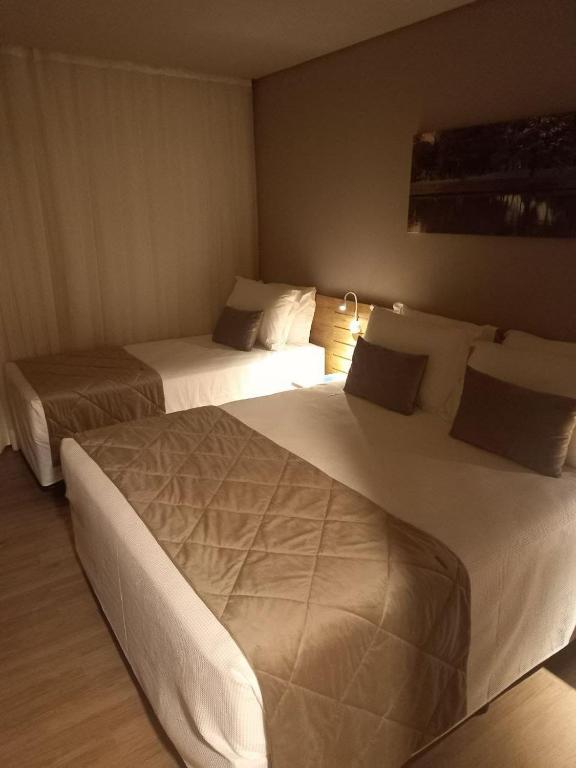 Postel nebo postele na pokoji v ubytování Golden gramado resort Laghetto