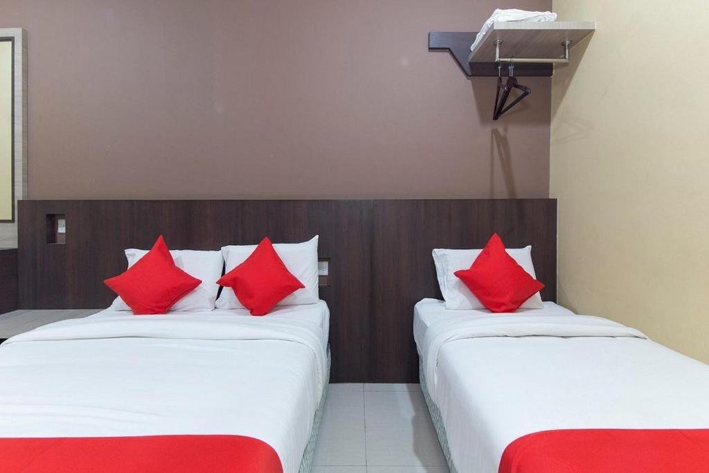 Postel nebo postele na pokoji v ubytování Silibin Times Inn Hotel