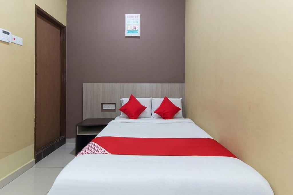 Postel nebo postele na pokoji v ubytování Silibin Times Inn Hotel