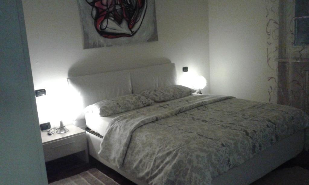 Łóżko lub łóżka w pokoju w obiekcie Villa Elisa Relax