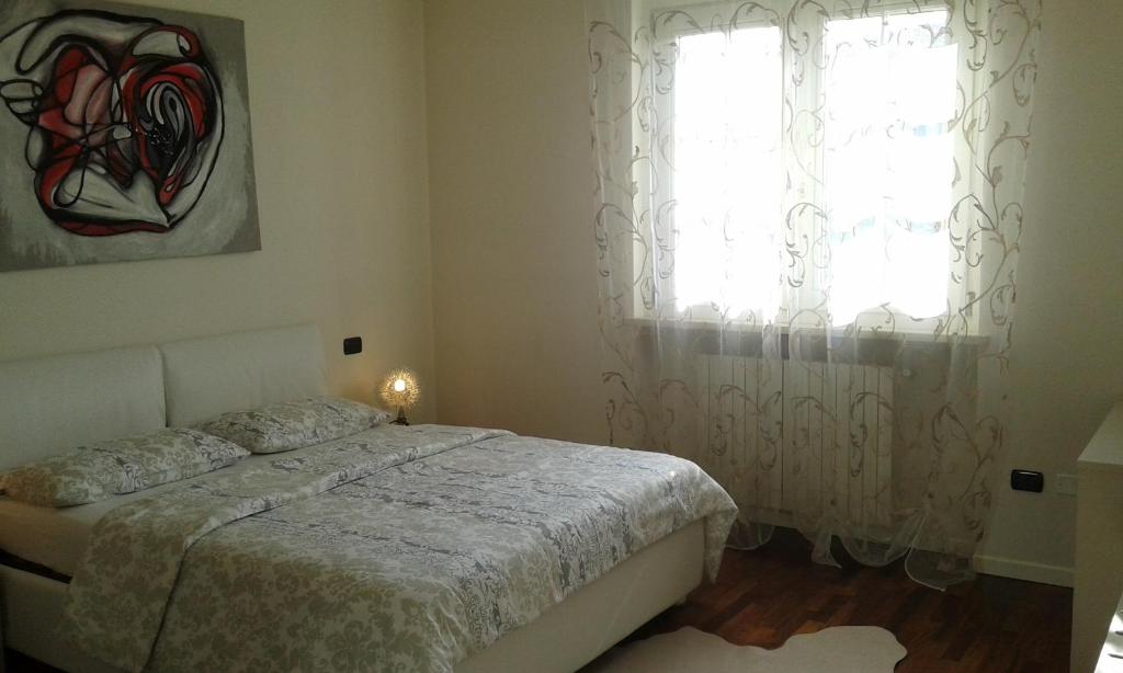 Łóżko lub łóżka w pokoju w obiekcie Villa Elisa Relax