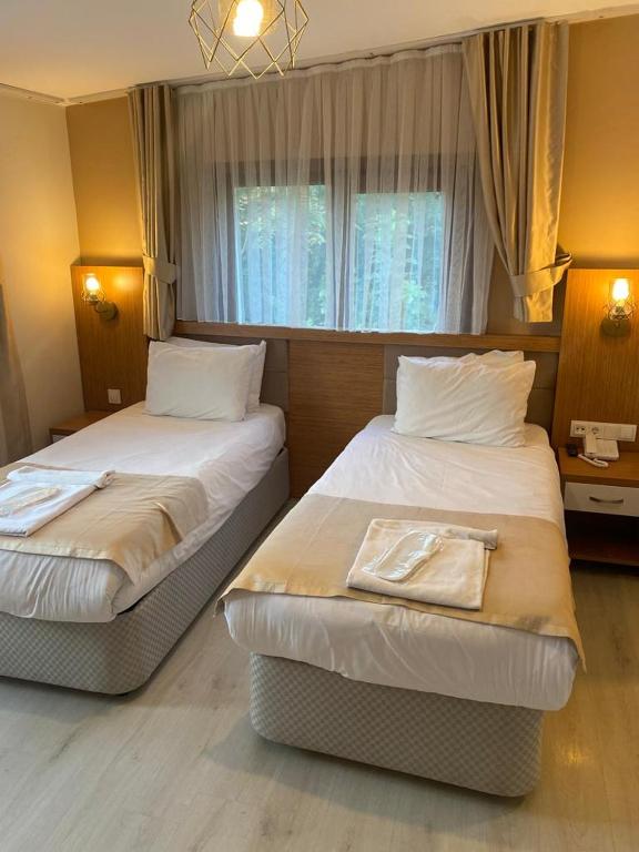 Postel nebo postele na pokoji v ubytování Zeyn Otel Istanbul