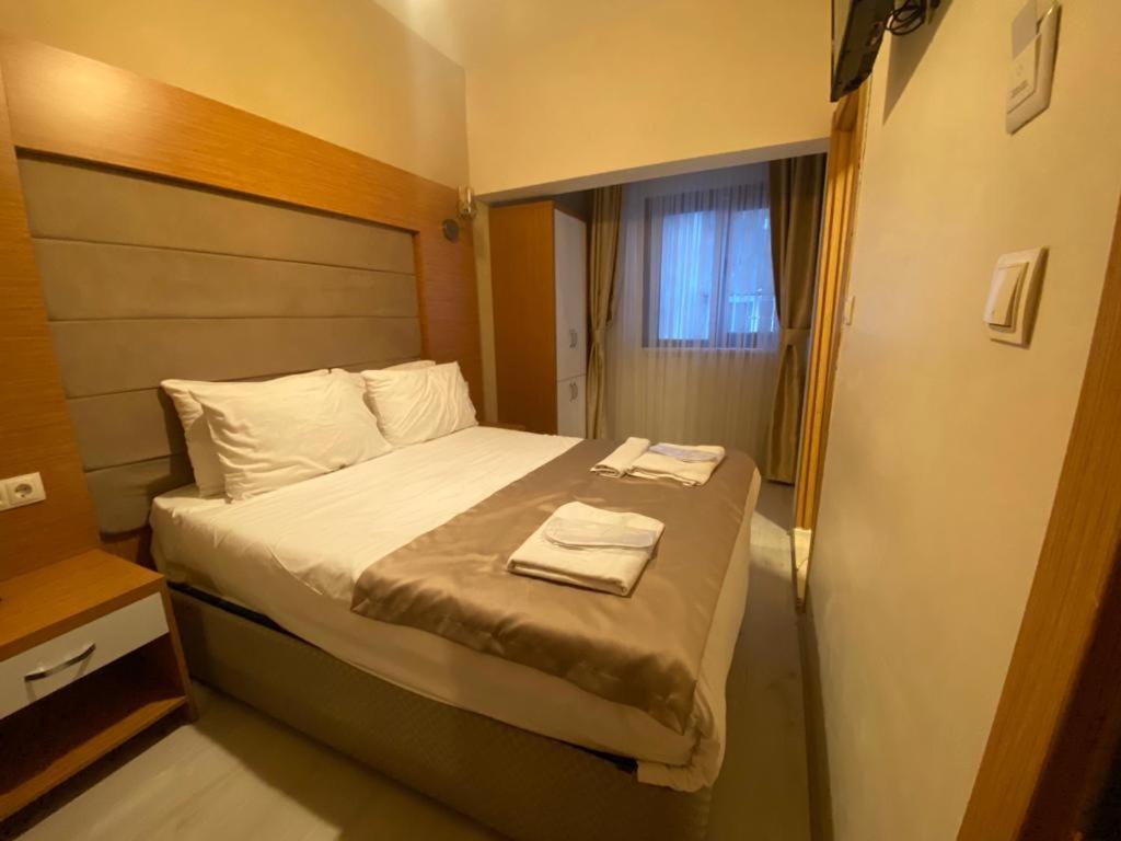Postel nebo postele na pokoji v ubytování Zeyn Otel Istanbul