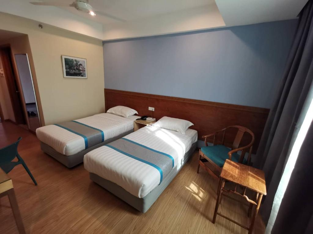 Postel nebo postele na pokoji v ubytování TD CAPITAL HOTEL