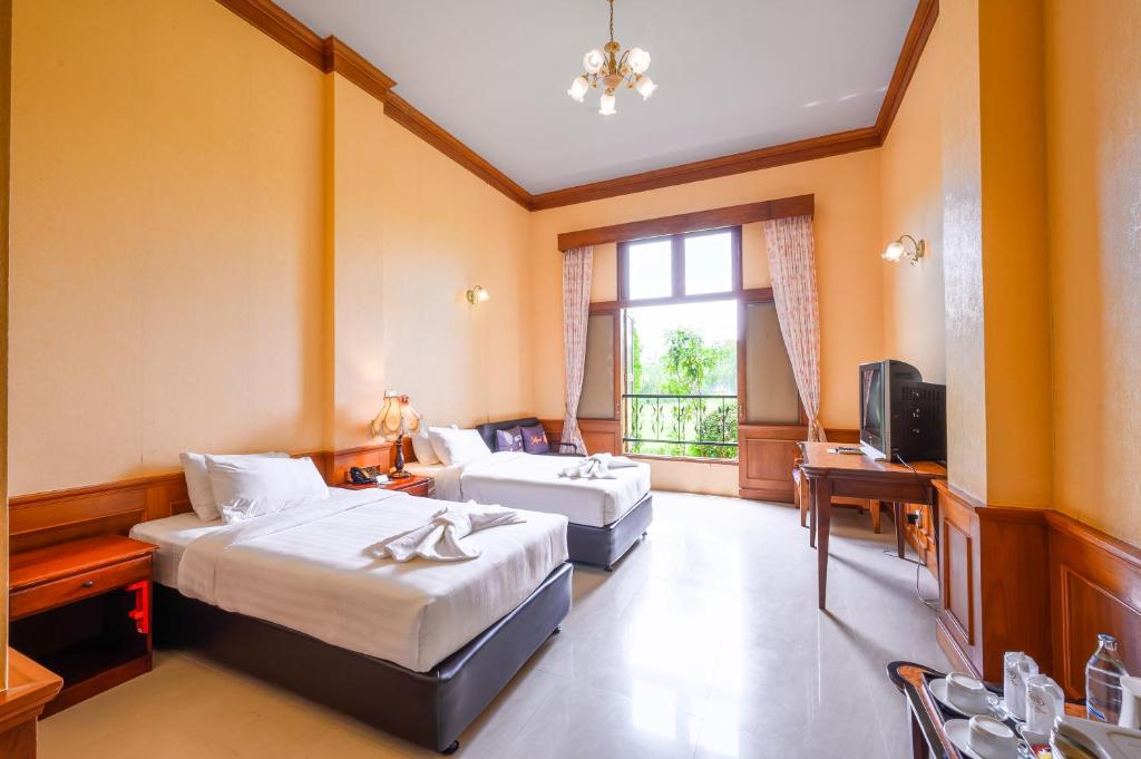 Postel nebo postele na pokoji v ubytování Chateau de Khaoyai Hotel & Resort