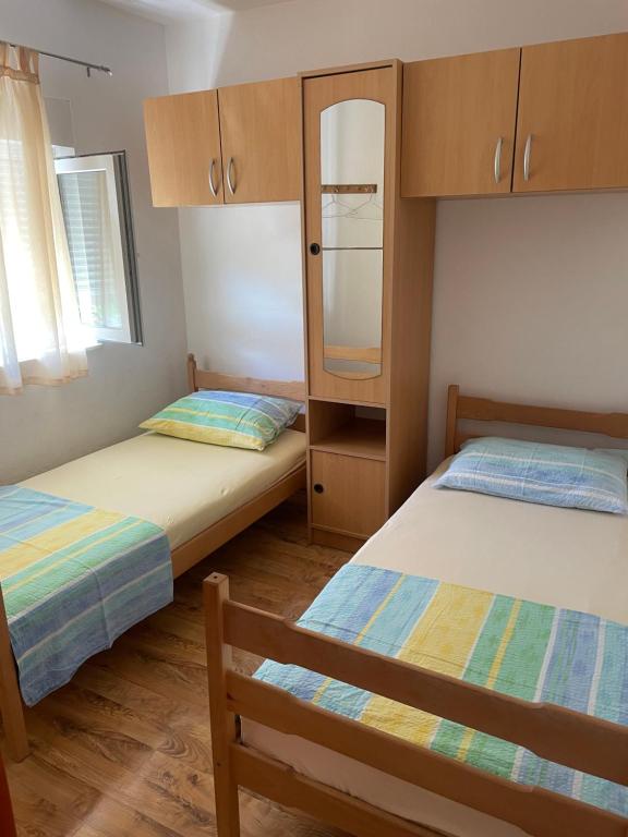 Postel nebo postele na pokoji v ubytování Apartman Jukic