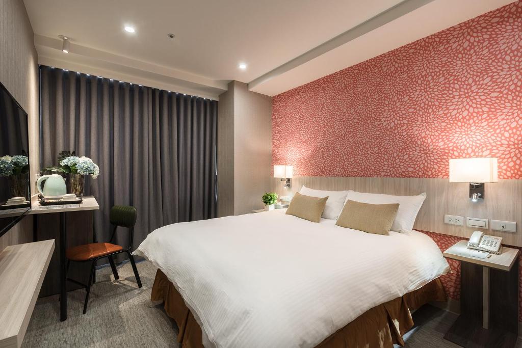 Postel nebo postele na pokoji v ubytování Comma Boutique Hotel