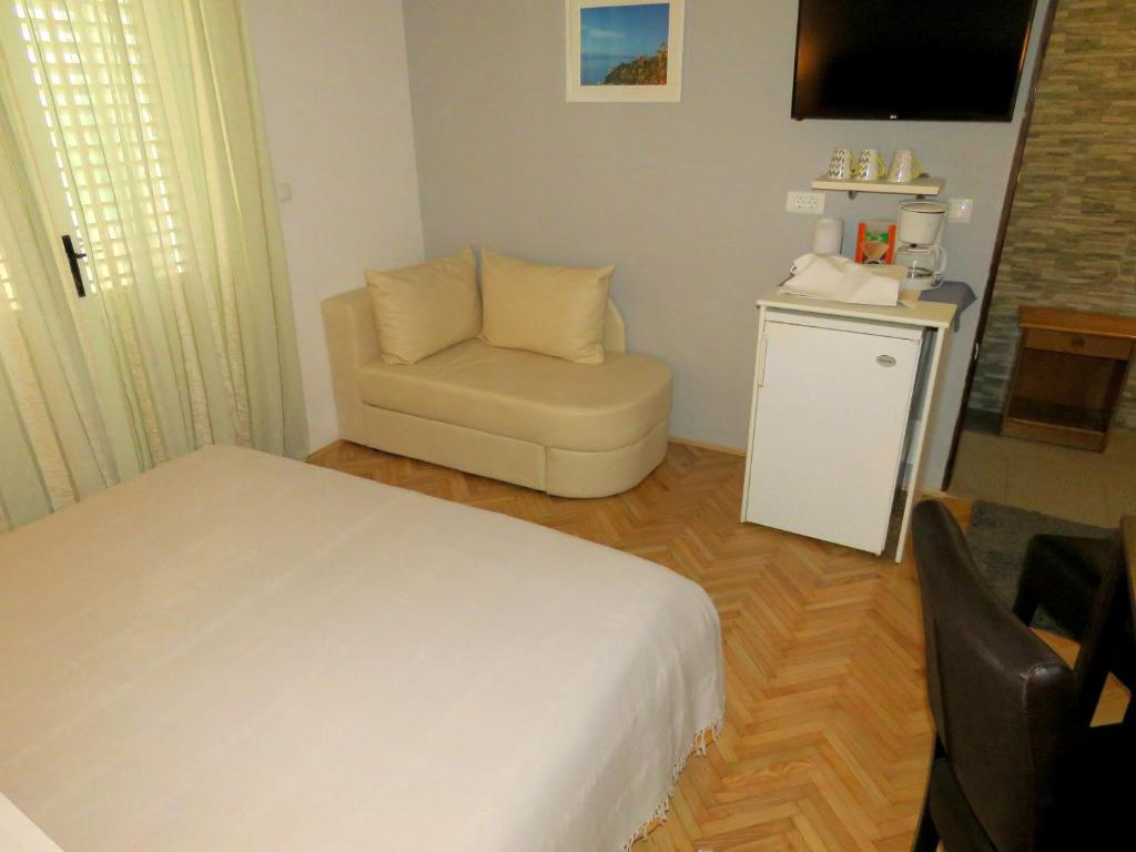 Posteľ alebo postele v izbe v ubytovaní Apartments Staničić