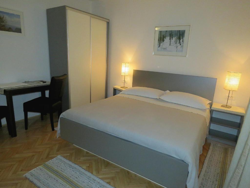 Posteľ alebo postele v izbe v ubytovaní Apartments Staničić