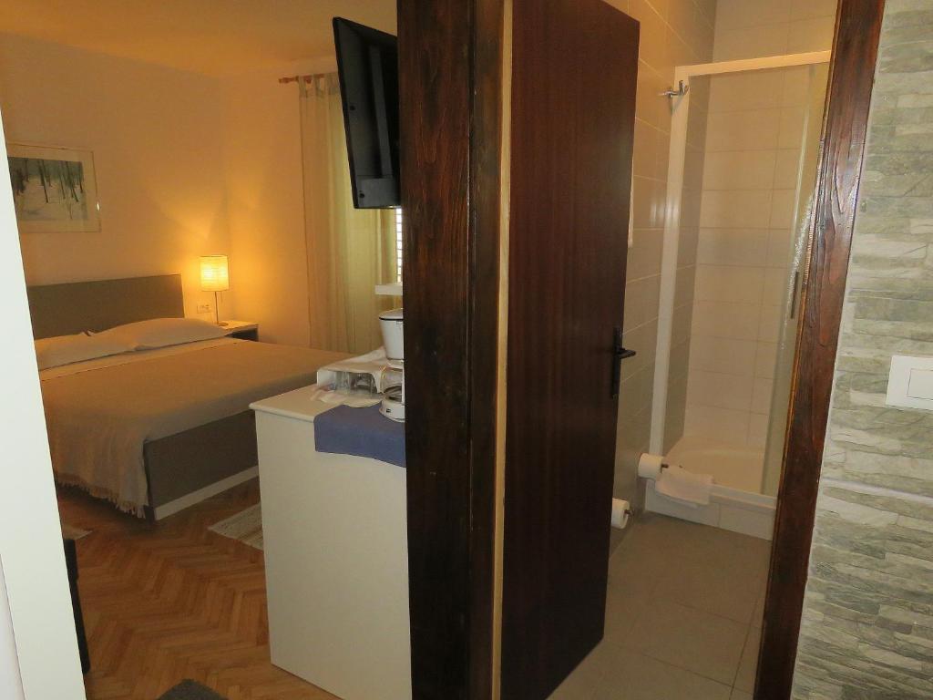 Posteľ alebo postele v izbe v ubytovaní Apartments Staničić