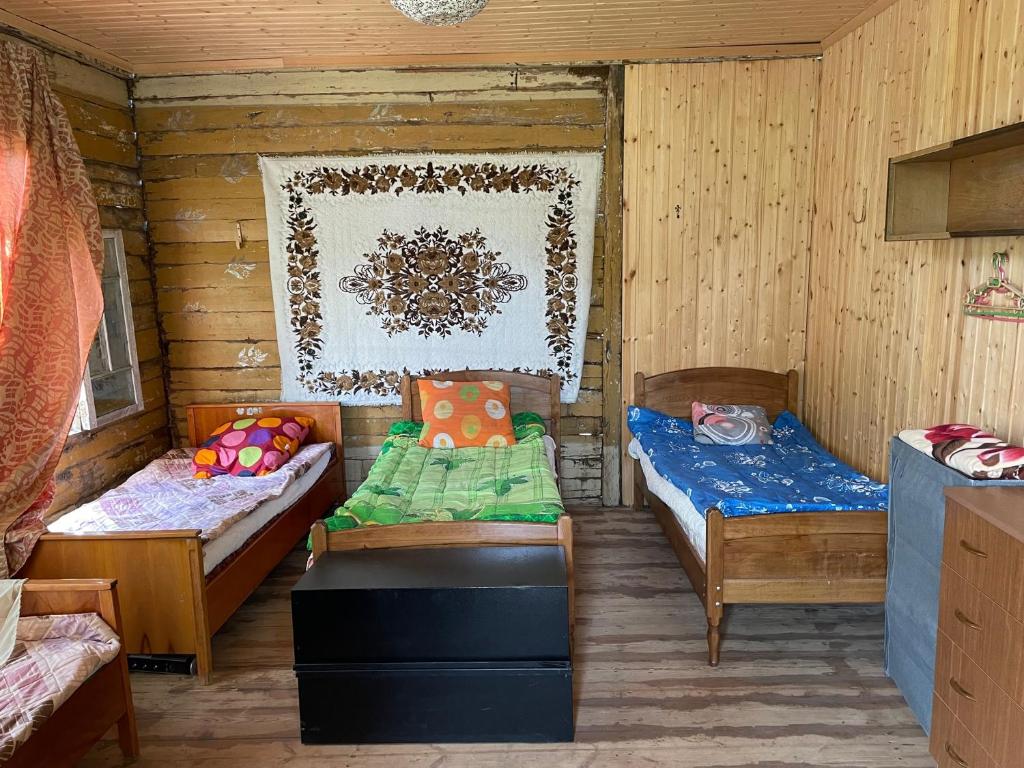 Postel nebo postele na pokoji v ubytování Sveri Adventure Camp