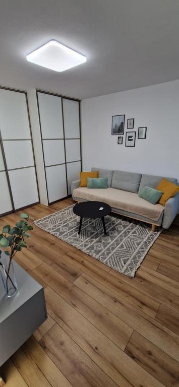 a living room with a couch and a rug at Apartment Terasa Kosice in Košice