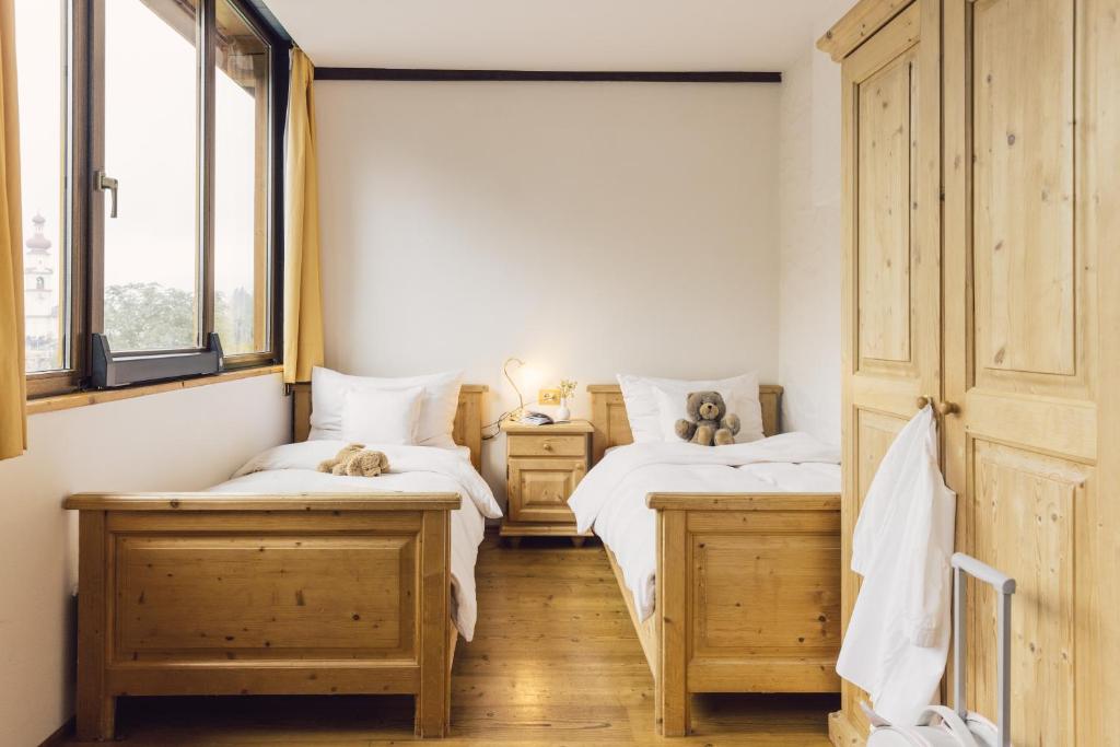Postel nebo postele na pokoji v ubytování Parkhotel Schachen