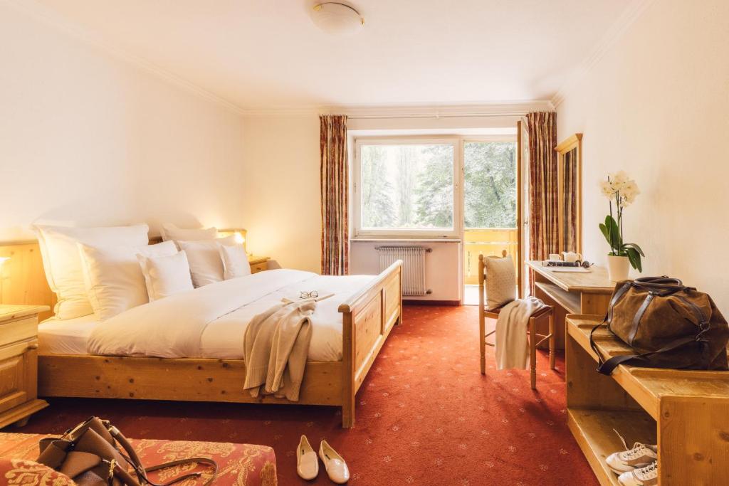 Postel nebo postele na pokoji v ubytování Parkhotel Schachen