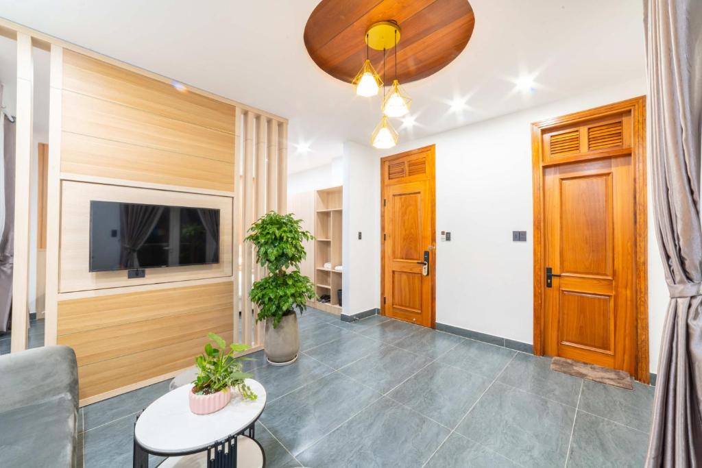 TV a/nebo společenská místnost v ubytování Quốc Khánh Condotel