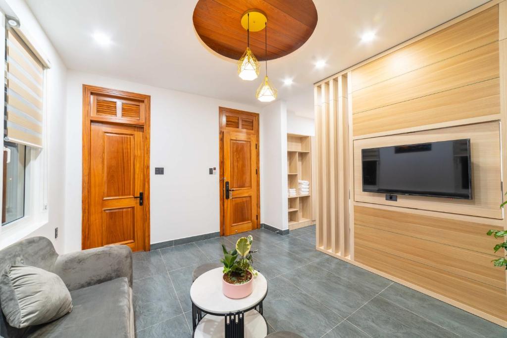 TV a/nebo společenská místnost v ubytování Quốc Khánh Condotel