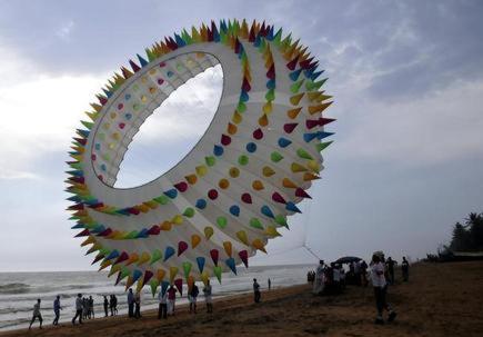 a large kite is being flown on a beach at Hotel Sunday - Townhouse Club Airport Trivandrum in Trivandrum