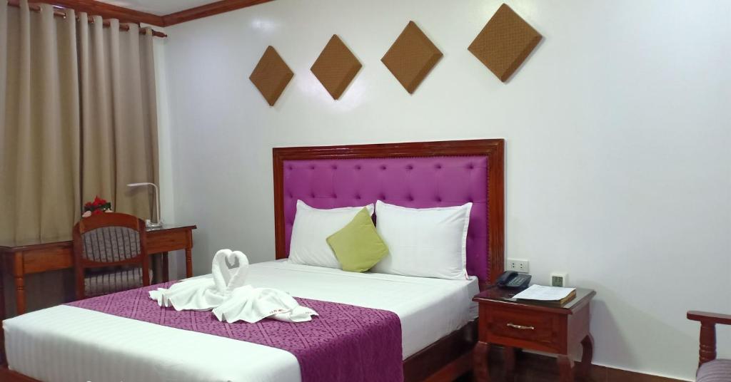 Postel nebo postele na pokoji v ubytování CLN Boutique Hotel