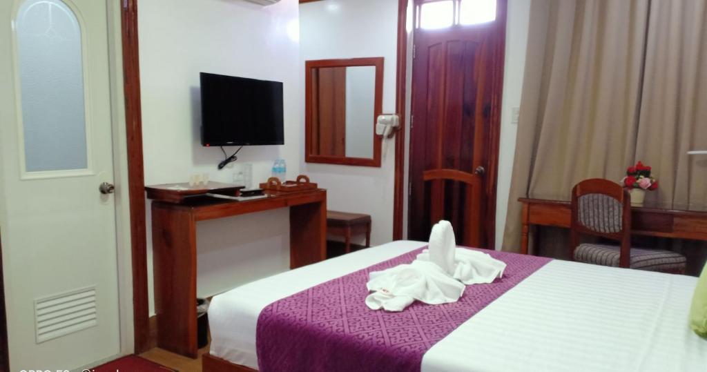 Postel nebo postele na pokoji v ubytování CLN Boutique Hotel