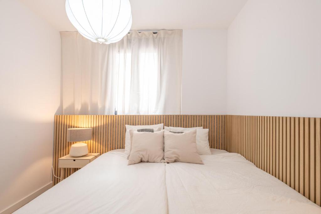 Posteľ alebo postele v izbe v ubytovaní Malasaña 13, Nuevo apartamento 2 dormitorios, centro histórico, todos servicios, barrio tranquilo, MS