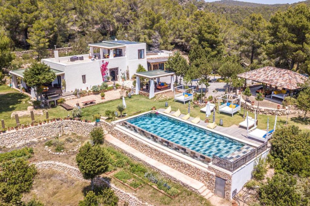 an aerial view of a house with a swimming pool at Can Sabina - San Antonio in Santa Agnès de Corona
