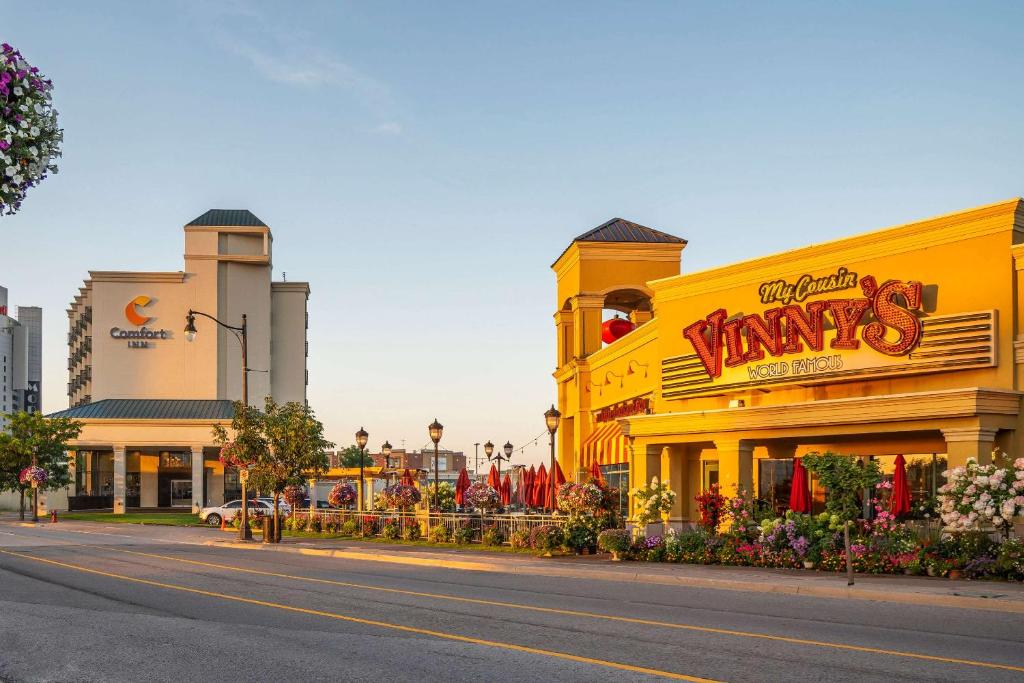 a yellow building with a sign on the side of a street at Comfort Inn Fallsview in Niagara Falls