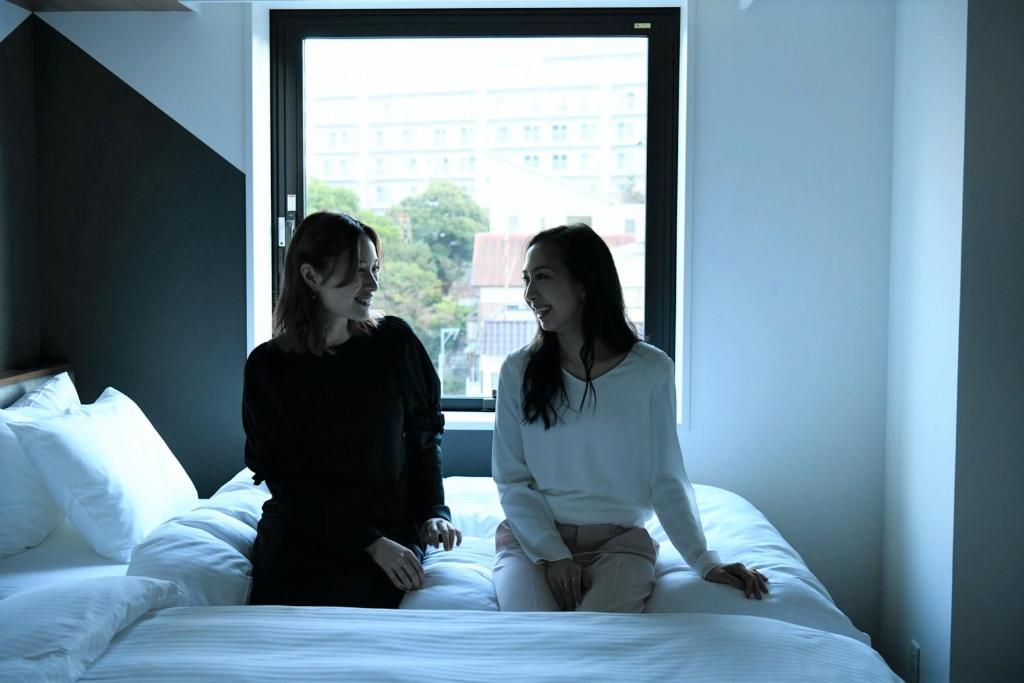 Rúm í herbergi á Prince Smart Inn Atami
