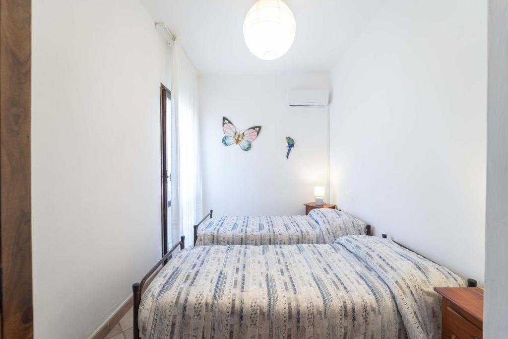 Posteľ alebo postele v izbe v ubytovaní Stintino sea front apartments B