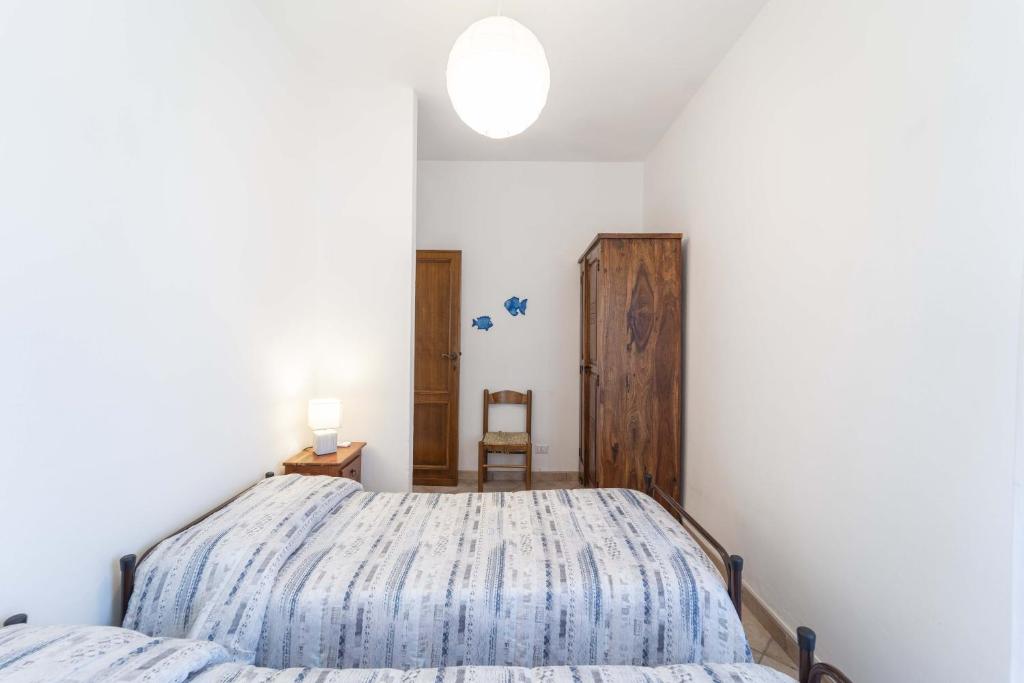 Posteľ alebo postele v izbe v ubytovaní Stintino sea front apartments B