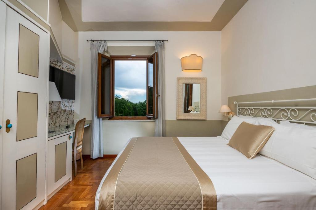Postel nebo postele na pokoji v ubytování Albergo Le Terme